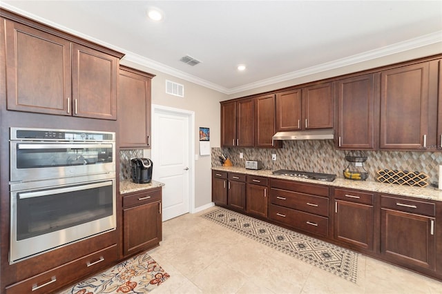 kitchen featuring backsplash, light stone countertops, appliances with stainless steel finishes, ornamental molding, and dark brown cabinets