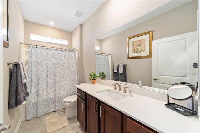 bathroom featuring tile patterned floors, toilet, vanity, and a shower with shower curtain