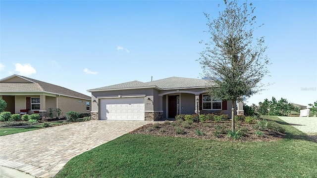 view of front of house with a front yard and a garage