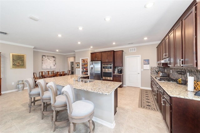 8731 SW 76th Street Rd, Ocala, FL 34481 - kitchen with stainless steel appliances, recessed lighting, backsplash, a sink, and a large island with sink