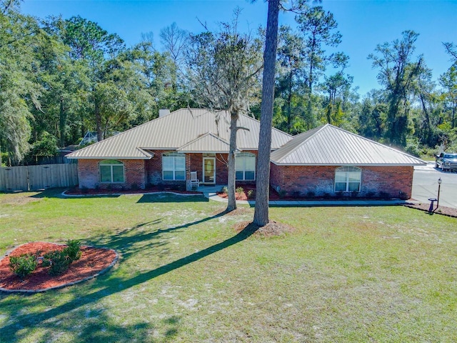 single story home with a front lawn