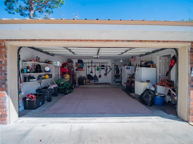 garage featuring white fridge