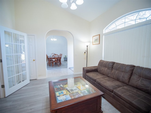 living room with a chandelier and hardwood / wood-style flooring