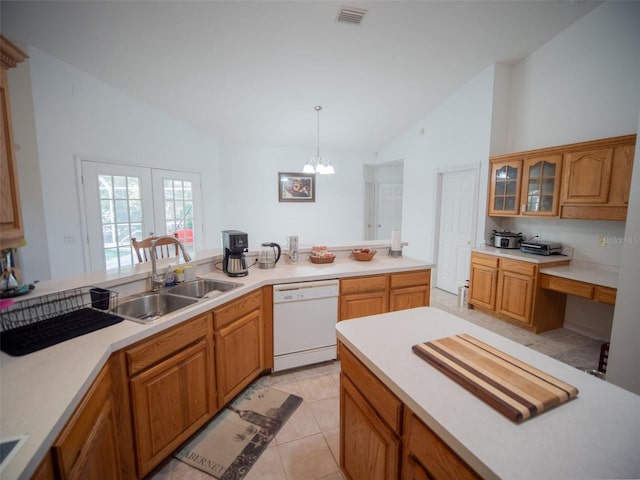 kitchen with white dishwasher, hanging light fixtures, lofted ceiling, and sink