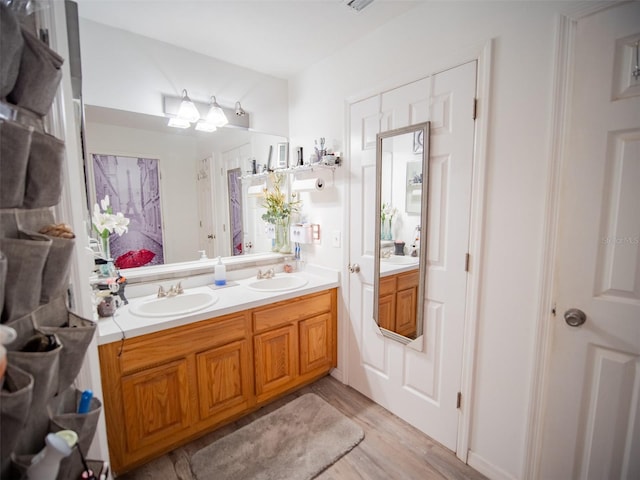 bathroom featuring vanity and wood-type flooring