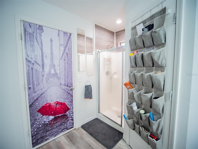 bathroom with hardwood / wood-style floors