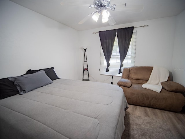 bedroom featuring hardwood / wood-style flooring and ceiling fan