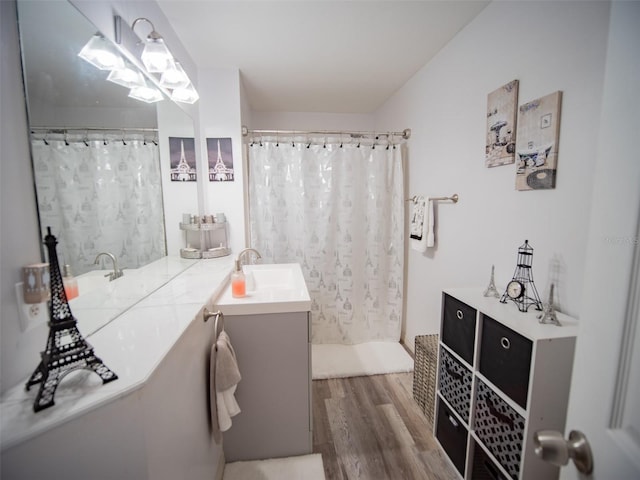 bathroom featuring hardwood / wood-style floors, vanity, and a shower with curtain