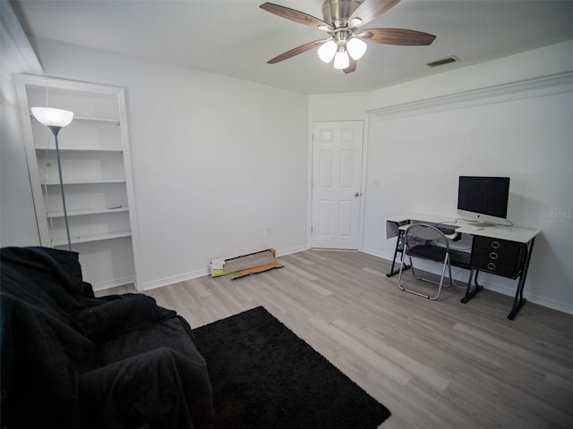 office area featuring light hardwood / wood-style flooring and ceiling fan