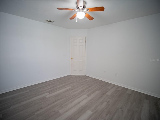 spare room featuring ceiling fan and wood-type flooring