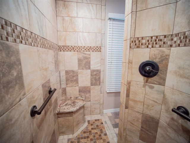 bathroom featuring a tile shower