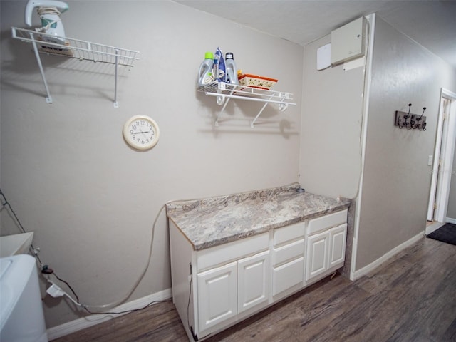 bathroom with hardwood / wood-style floors and vanity