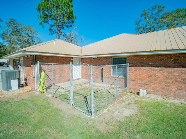 view of side of property featuring central AC unit