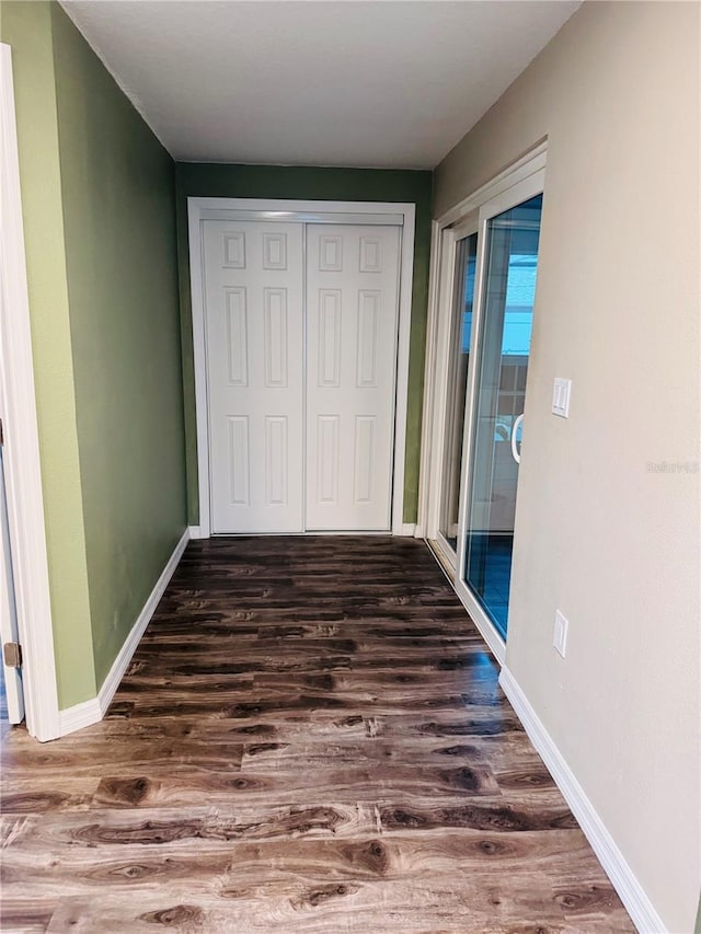 hallway featuring dark hardwood / wood-style floors