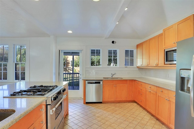 kitchen featuring beam ceiling, light stone countertops, sink, stainless steel appliances, and tasteful backsplash