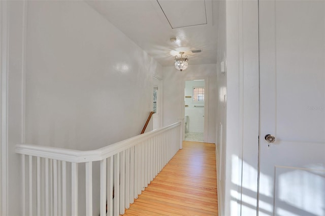 hall with light hardwood / wood-style floors