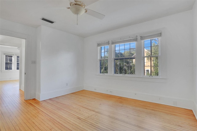 spare room featuring ceiling fan and light hardwood / wood-style flooring