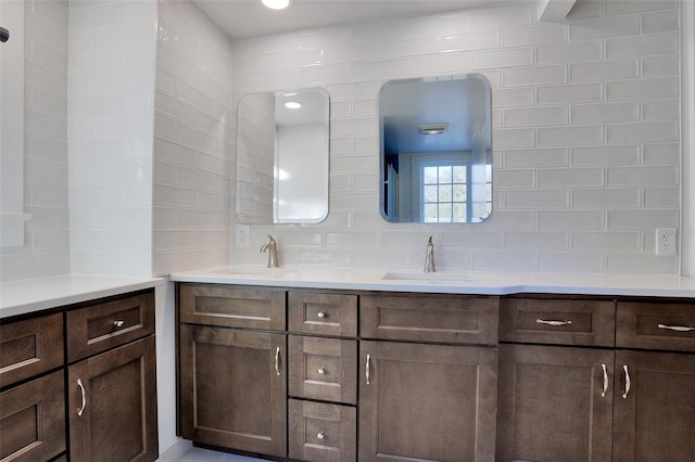 bathroom featuring decorative backsplash and vanity