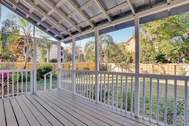 wooden deck with a lawn