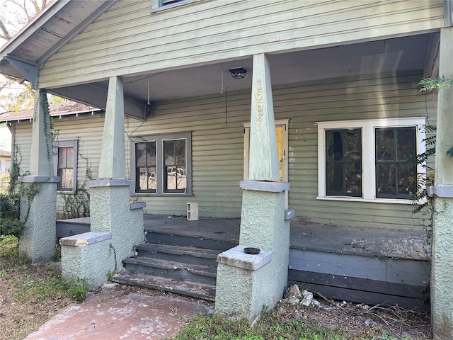 doorway to property featuring a porch