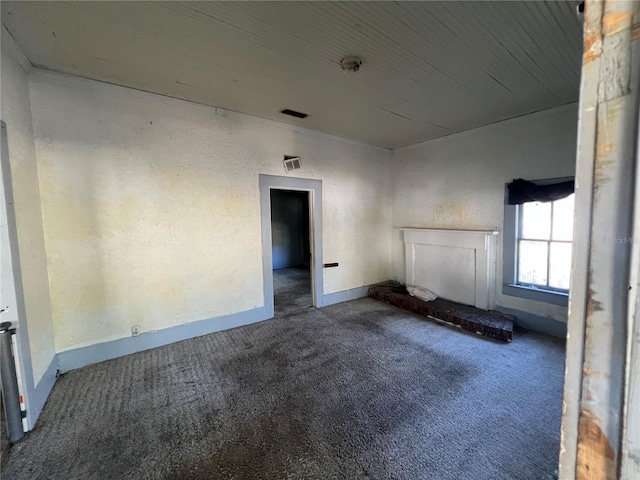 unfurnished living room featuring carpet