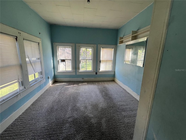 spare room featuring light colored carpet