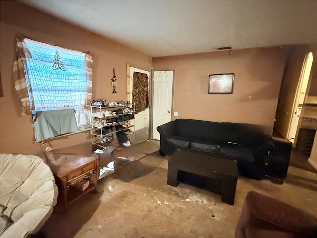 living room featuring concrete flooring