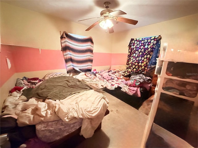 bedroom featuring ceiling fan and carpet