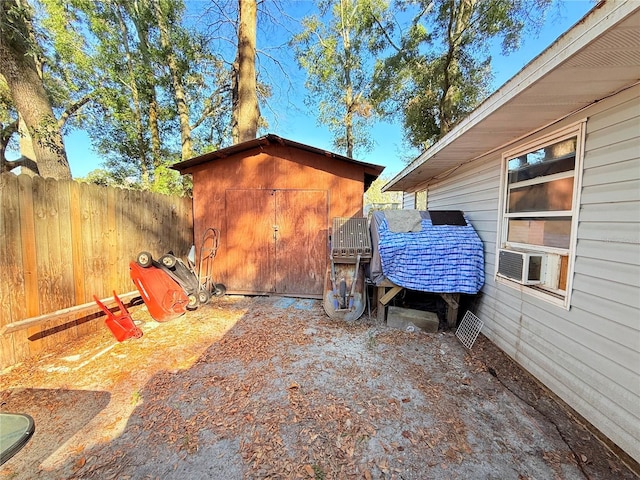 view of patio / terrace with a storage unit and cooling unit