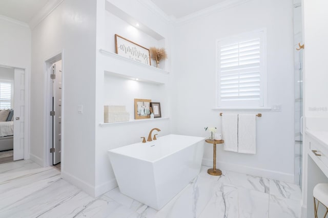 bathroom with crown molding and a tub