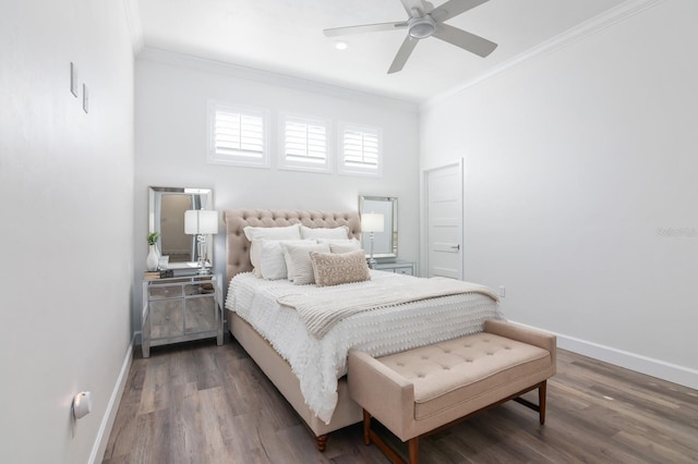 bedroom featuring ceiling fan, dark hardwood / wood-style flooring, and crown molding