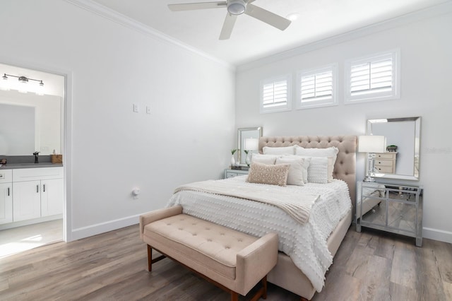 bedroom with ceiling fan, hardwood / wood-style floors, crown molding, and sink