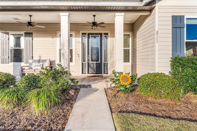 entrance to property with ceiling fan and covered porch