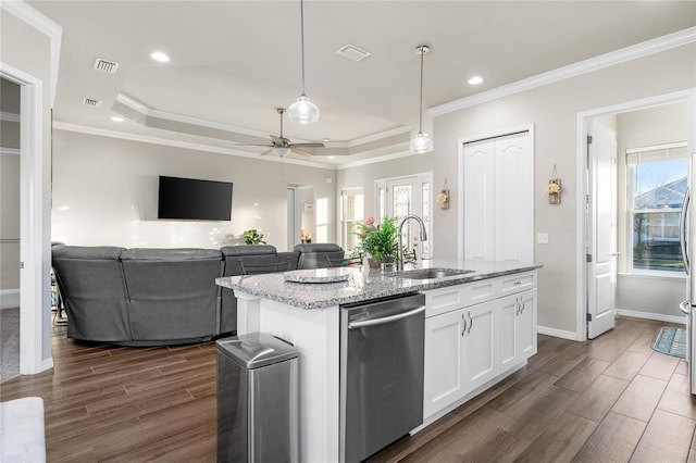 kitchen with dishwasher, white cabinets, a center island with sink, sink, and hanging light fixtures