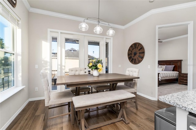 dining space with crown molding and dark wood-type flooring