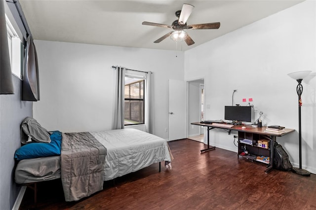 bedroom with ceiling fan and dark hardwood / wood-style floors