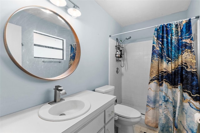 bathroom featuring toilet, vanity, and a shower with curtain