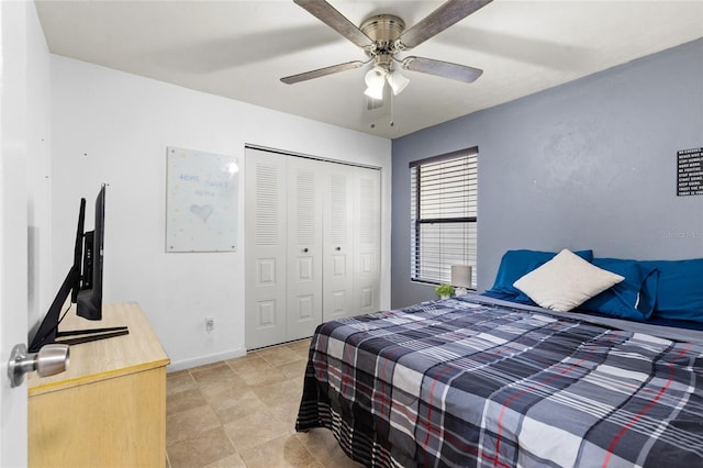 bedroom featuring ceiling fan and a closet