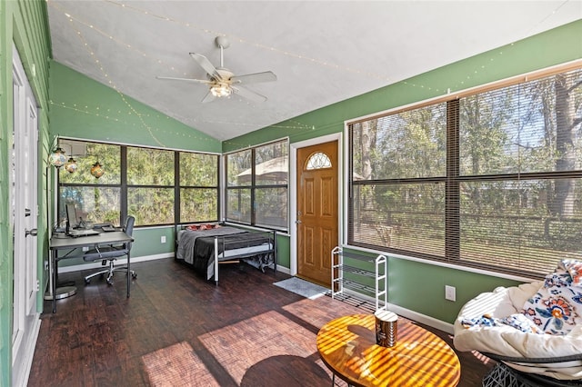 sunroom / solarium featuring ceiling fan and vaulted ceiling