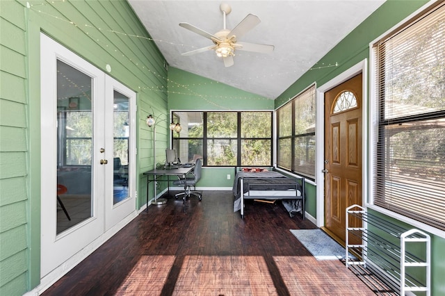 unfurnished sunroom with ceiling fan, plenty of natural light, and lofted ceiling