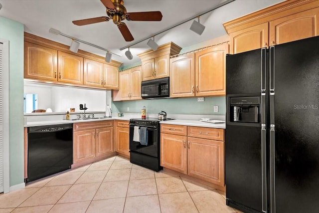 kitchen with sink, black appliances, ceiling fan, and light tile patterned floors