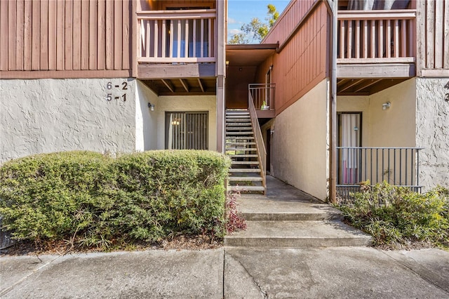 entrance to property with a balcony