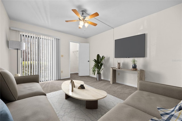 carpeted living room featuring ceiling fan