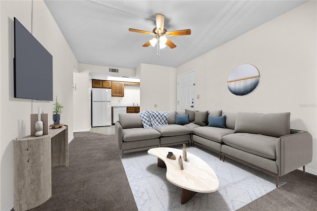 carpeted living room featuring ceiling fan