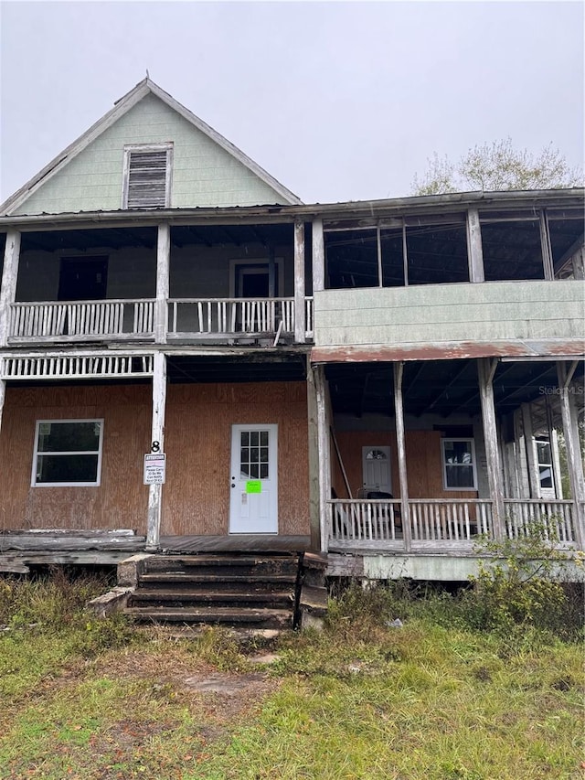 view of front of property with a balcony