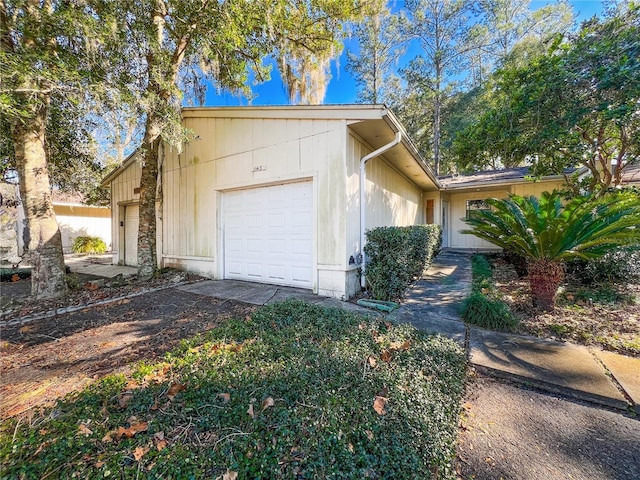 view of side of property with a garage