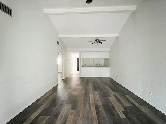 hallway with beam ceiling, dark hardwood / wood-style flooring, and high vaulted ceiling