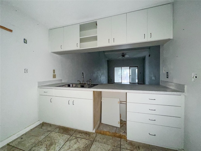 kitchen with sink and white cabinets