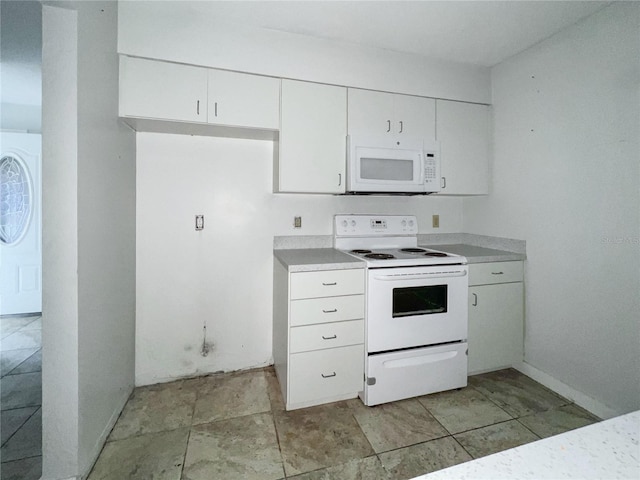 kitchen with white cabinetry and white appliances