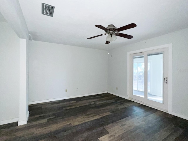 empty room featuring ceiling fan and dark hardwood / wood-style flooring